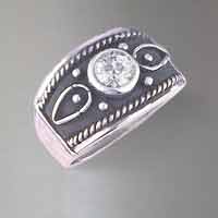 Sterling greek style band set with one round brilliant cut diamond weighs .84 carat. G color I-3 clarity